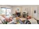 Stylish living room featuring a cozy fireplace, comfortable seating, and access to the balcony at 5300 E Cherry Creek South Dr # 124, Denver, CO 80246