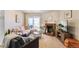 Charming living room features a brick fireplace, sliding door to the balcony and contemporary decor at 5300 E Cherry Creek South Dr # 124, Denver, CO 80246
