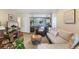 Comfortable living room with neutral tones, fireplace, and an open layout with dining area at 5300 E Cherry Creek South Dr # 124, Denver, CO 80246