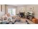 Inviting living room with a cozy fireplace, balcony access, and a relaxed atmosphere at 5300 E Cherry Creek South Dr # 124, Denver, CO 80246