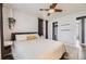 The bedroom has hardwood floors, a patterned accent wall and matching bedside tables at 1374 S Beach Ct, Denver, CO 80219