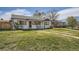 Inviting home with a well-manicured lawn and charming curb appeal on a sunny day at 1374 S Beach Ct, Denver, CO 80219