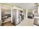 Modern kitchen with stainless steel appliances, stylish decor, and a seamless open layout at 1374 S Beach Ct, Denver, CO 80219