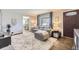 Comfortable living room featuring a plush rug, neutral tones, and ample natural light at 1374 S Beach Ct, Denver, CO 80219