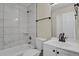 Bathroom featuring tub/shower combo, single vanity, and neutral wall color at 14308 E Whitaker Pl # 114, Aurora, CO 80015