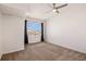 Serene bedroom with a large window and ample natural light, perfect for rest at 5756 N Genoa Way # 12-305, Aurora, CO 80019
