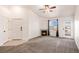 Cozy living room featuring a fireplace, ceiling fan and large window for ample natural light at 5756 N Genoa Way # 12-305, Aurora, CO 80019