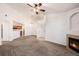 Open living room featuring a fireplace and adjoined to the kitchen area at 5756 N Genoa Way # 12-305, Aurora, CO 80019
