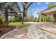 Outdoor living with a spacious patio, stone walkway, and landscaped yard, ideal for entertaining at 6247 S Locust St, Centennial, CO 80111
