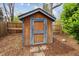 Wooden storage shed, perfect for gardening tools, providing ample storage space and organization at 6247 S Locust St, Centennial, CO 80111