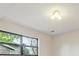 Window view features mature trees with greenery, a neighboring house, and blue skies at 6247 S Locust St, Centennial, CO 80111