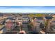 Wide aerial shot of home showcasing solar panels and neighborhood, with mountain backdrop at 4787 Dunkirk St, Denver, CO 80249