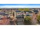 Aerial view of the home with solar panels and mountain views in the background at 4787 Dunkirk St, Denver, CO 80249