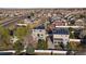 Aerial view of neighborhood homes showcasing solar panels, fenced yards and two-story exteriors at 4787 Dunkirk St, Denver, CO 80249