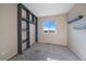 This bedroom includes carpet, a storage unit, and a window with views at 4787 Dunkirk St, Denver, CO 80249
