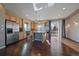 Sun-filled kitchen with stainless steel appliances, granite counters, and an island at 4787 Dunkirk St, Denver, CO 80249