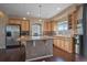 Spacious kitchen featuring granite countertops, stainless steel appliances, and an island at 4787 Dunkirk St, Denver, CO 80249