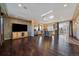 Hardwood floors lead into a kitchen and large living area with outdoor patio access at 4787 Dunkirk St, Denver, CO 80249