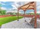 A backyard patio featuring a pergola, stone flooring, and outdoor seating, perfect for relaxation at 638 W 175Th Ave, Broomfield, CO 80023