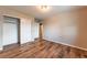 Bedroom featuring wood floors, closet doors, and neutral paint at 638 W 175Th Ave, Broomfield, CO 80023