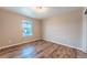 This bedroom has a light fixture, light walls and wood floors at 638 W 175Th Ave, Broomfield, CO 80023