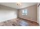 This bedroom has a light fixture and wood floors and bright natural light at 638 W 175Th Ave, Broomfield, CO 80023