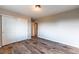 Bedroom featuring wood floors, sliding closet doors and neutral paint at 638 W 175Th Ave, Broomfield, CO 80023