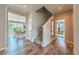 Welcoming entryway with wood floors, staircase, and views into the dining and living spaces at 638 W 175Th Ave, Broomfield, CO 80023