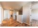 Upstairs hallway with wood floors, doors, and neutral paint at 638 W 175Th Ave, Broomfield, CO 80023