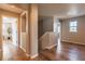 Upstairs hallway with wood floors, doors, and neutral paint at 638 W 175Th Ave, Broomfield, CO 80023
