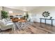 Stylish living room with modern decor, wood floors, and plenty of comfortable seating options at 638 W 175Th Ave, Broomfield, CO 80023