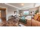 Bright main bedroom with wood floors, tray ceiling, and stylish decor at 638 W 175Th Ave, Broomfield, CO 80023