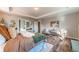 Bright main bedroom with wood floors, tray ceiling, and stylish decor at 638 W 175Th Ave, Broomfield, CO 80023