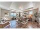 Bright main bedroom with wood floors, tray ceiling, and stylish decor at 638 W 175Th Ave, Broomfield, CO 80023