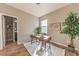 Bright office with a modern wood desk on a plush rug, complemented by stylish decor and ample natural light at 638 W 175Th Ave, Broomfield, CO 80023