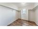 Spacious walk-in closet with wooden floors, bright lighting, shelving, and a window view at 638 W 175Th Ave, Broomfield, CO 80023