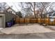 Spacious concrete pad with wood fence offers potential parking space or extra room at 482 N Humboldt St, Denver, CO 80218