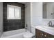 Stylish bathroom featuring a bathtub, modern fixtures, and sleek tiling at 482 N Humboldt St, Denver, CO 80218