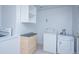 Functional laundry room equipped with modern appliances and ample storage space at 482 N Humboldt St, Denver, CO 80218