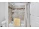 Well-maintained bathroom featuring a shower over tub with tiled surround at 10950 W Florida Ave # 303, Lakewood, CO 80232