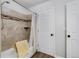 Clean bathroom with shower, a tub with tile surround and modern fixtures at 10950 W Florida Ave # 303, Lakewood, CO 80232