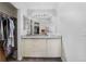 Modern bathroom vanity with granite countertop, vessel sink and access to the closet at 10950 W Florida Ave # 303, Lakewood, CO 80232