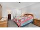 Inviting bedroom with a bed with a quilt, two windows and dresser storage at 10950 W Florida Ave # 303, Lakewood, CO 80232