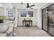 Bright dining area adjacent to the kitchen with two windows and a sliding glass door to the balcony at 10950 W Florida Ave # 303, Lakewood, CO 80232