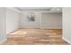Basement living area featuring wood grain floors, neutral paint, a window and plenty of sunlight at 1996 W 66Th Ave, Denver, CO 80221