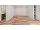 A light and bright finished basement area with wood grain floors and neutral paint at 1996 W 66Th Ave, Denver, CO 80221