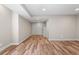 Finished basement area with wood grain floors, neutral paint, and potential to be a home theater at 1996 W 66Th Ave, Denver, CO 80221