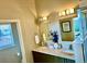 Bathroom with double vanity, marble countertops, and modern lighting fixtures at 1996 W 66Th Ave, Denver, CO 80221