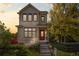 Charming two-story home with manicured front yard, lovely landscaping, and inviting front porch at 1996 W 66Th Ave, Denver, CO 80221