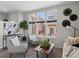 Bright living room with large windows, comfortable seating, and stylish decor, creating a cozy atmosphere at 1996 W 66Th Ave, Denver, CO 80221